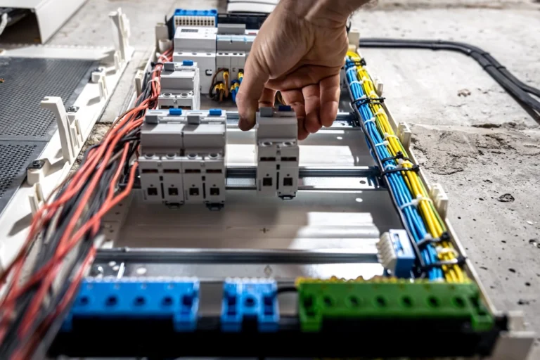 LENA Elektrik Hamburg | a male electrician works in a switchboard with an 2023 11 27 05 21 08 utc Gross