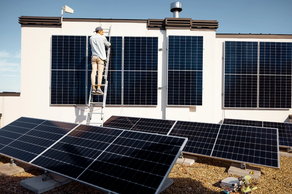 LENA Elektrik Hamburg | man installing solar panels on the roof of his hou 2024 01 10 16 48 58 utc Gross